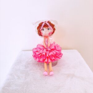 Muñeca de colo rosa