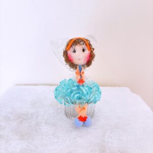 Muñeca de color celeste