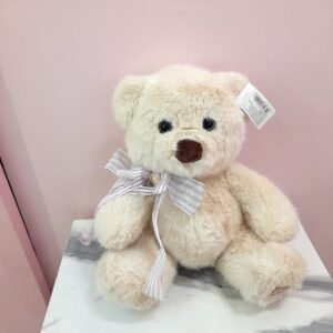 Peluche beige con lazo